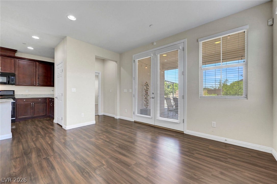3086 Ripe Peak Lane, Henderson, NV 89044 This inviting space features rich flooring, an integrated kitchen, and ample natural light.