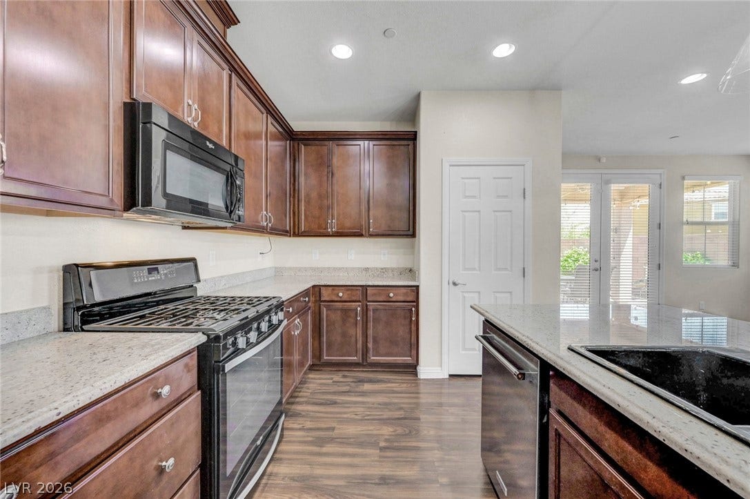3086 Ripe Peak Lane, Henderson, NV 89044 This functional kitchen features ample cabinetry and integrated appliances for modern living.