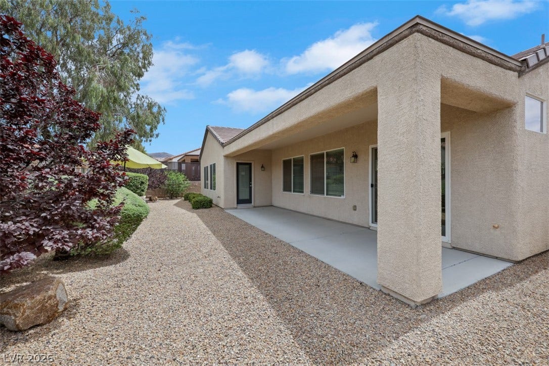 2408 Black River Falls Drive, Henderson, NV 89044 Enjoy outdoor living with this spacious patio, perfect for relaxing or entertaining.