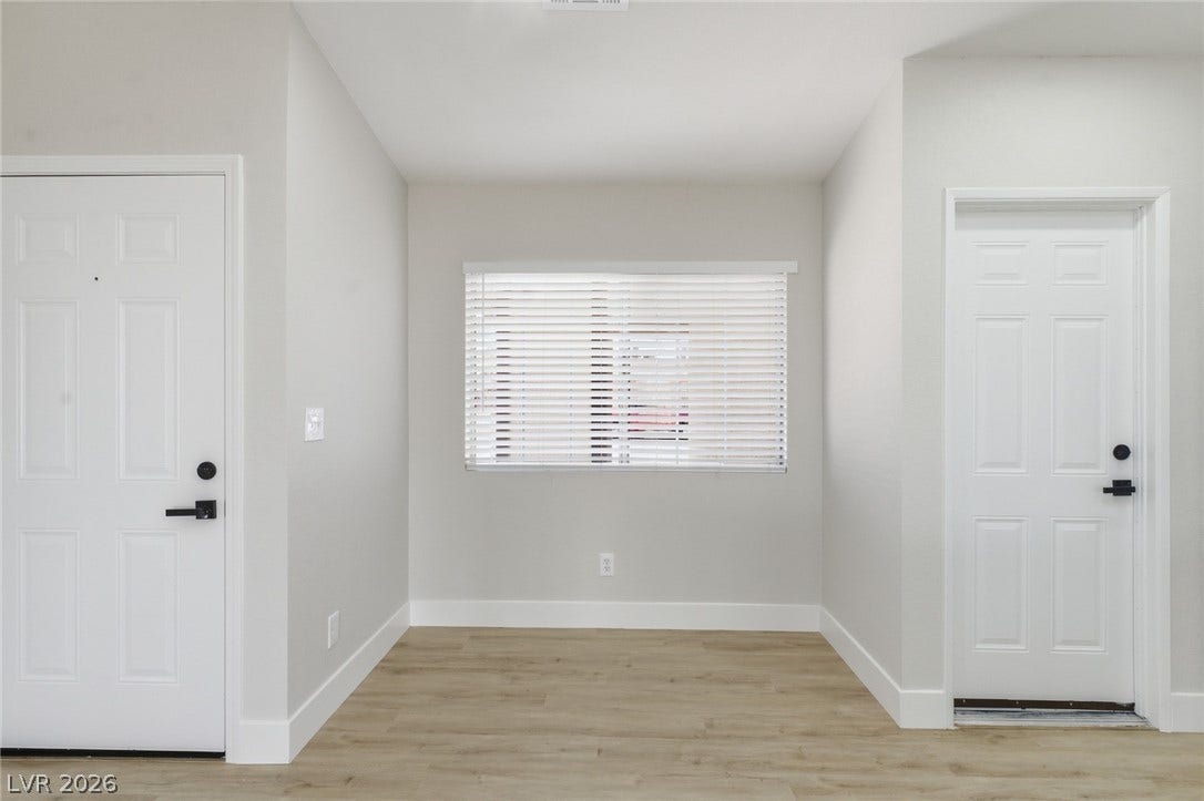 529 Close Avenue, Henderson, NV 89011 This bright, minimalist entry features durable flooring and a window, creating an inviting space.