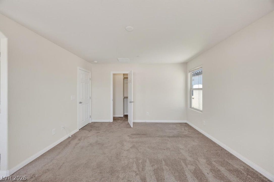 1116 Strada Cristallo, Henderson, NV 89011 A quiet retreat with plush carpeting and abundant natural light welcomes you home.