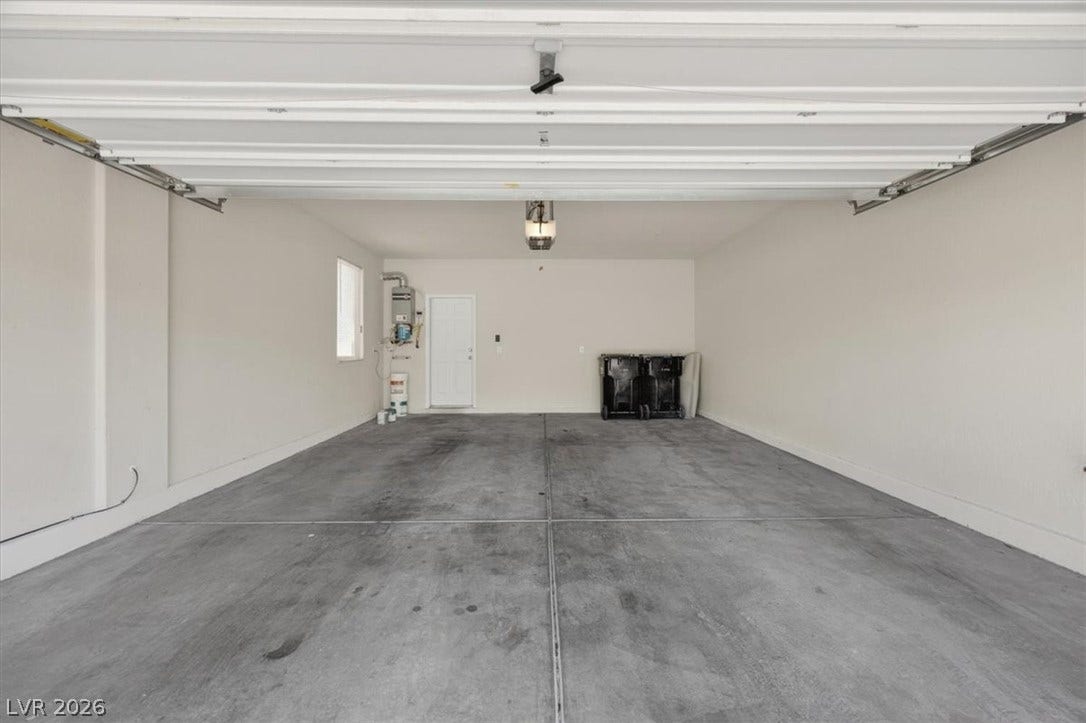 1116 Strada Cristallo, Henderson, NV 89011 A spacious, clean garage ready to accommodate vehicles and storage needs.