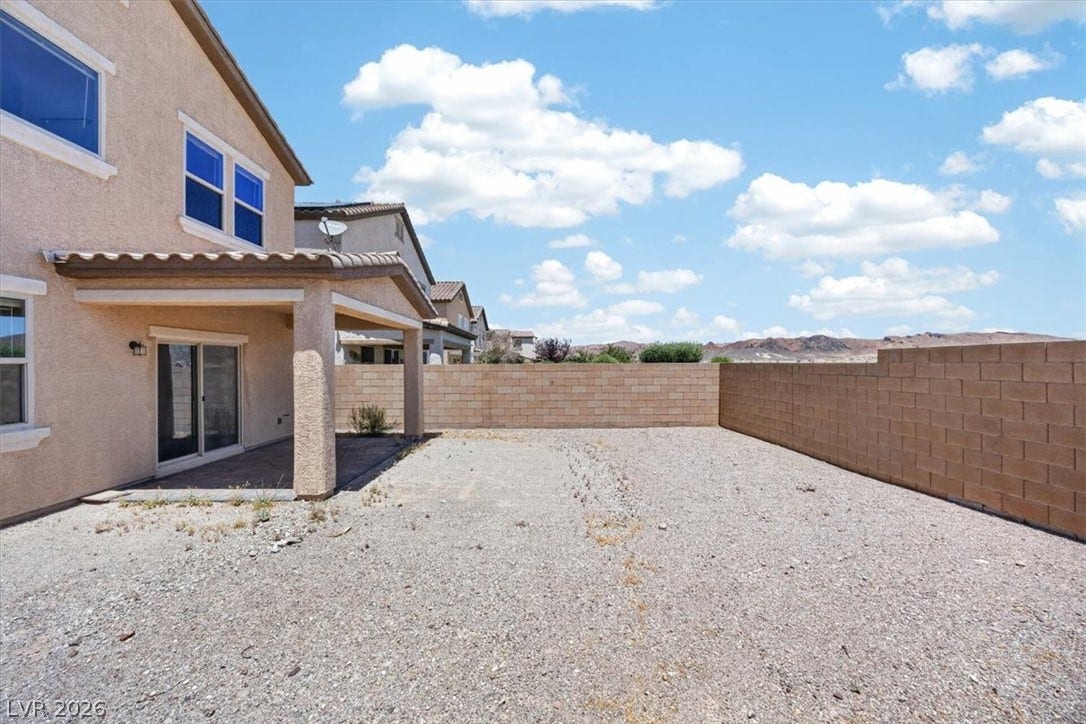 1116 Strada Cristallo, Henderson, NV 89011 A spacious backyard with a covered patio awaits your personal landscaping vision.
