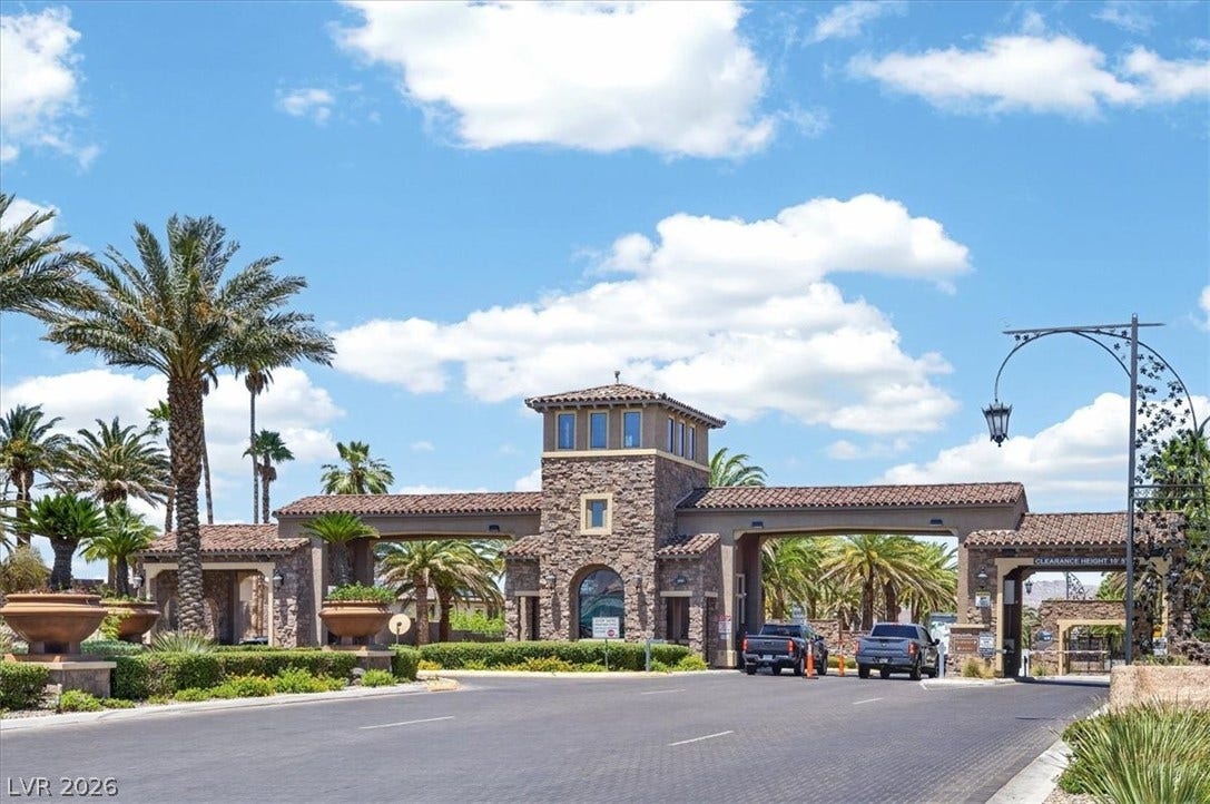 1116 Strada Cristallo, Henderson, NV 89011 A grand entrance with Mediterranean-inspired architecture welcomes residents and guests.