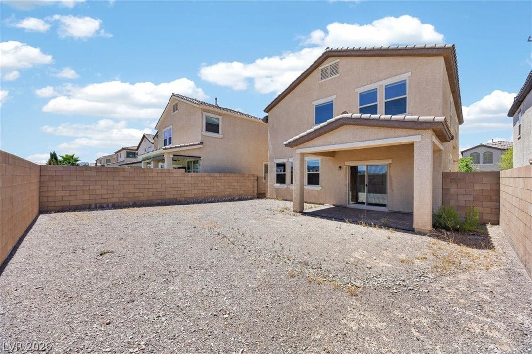 1116 Strada Cristallo, Henderson, NV 89011 A spacious backyard with a covered patio offers outdoor living potential.