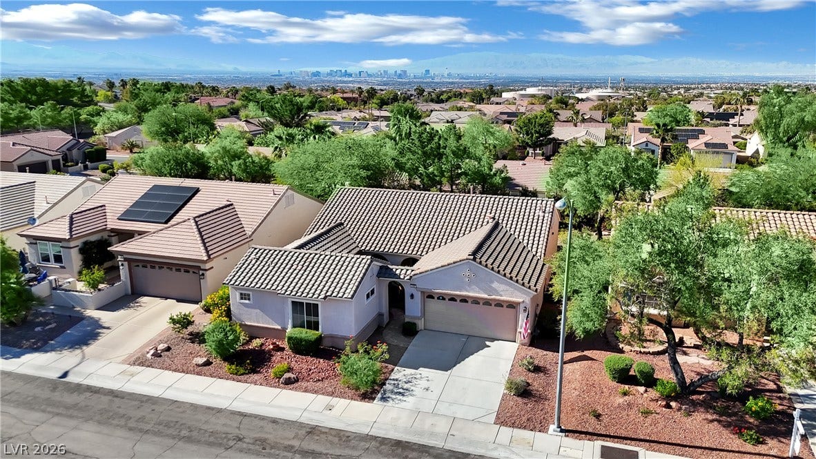 An inviting exterior with a tile roof and solar panels provides an elevated city view.