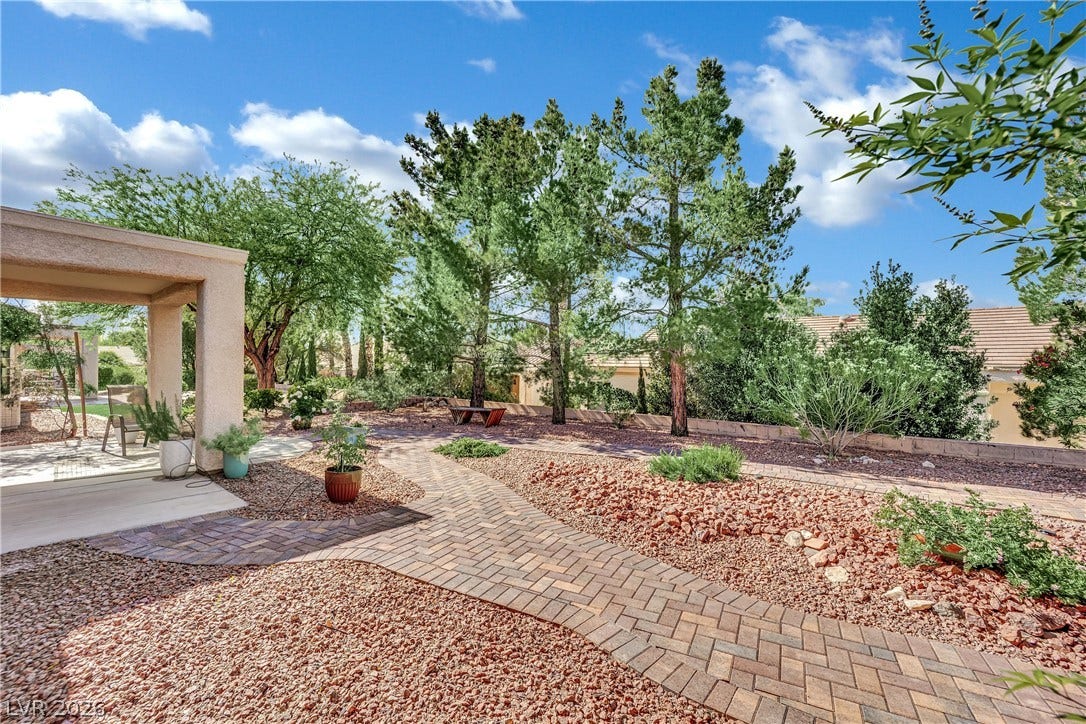 This serene outdoor space offers a private yard with a charming patio, perfect for relaxation.