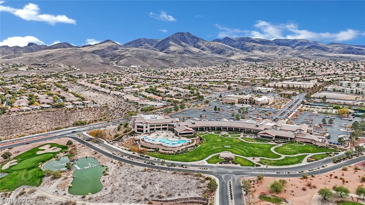 Vast mountain views frame this community, boasting a pool, golf course, and expansive grounds.