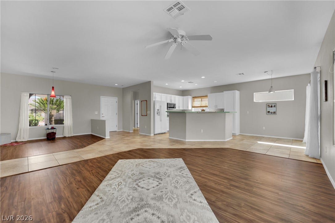 The open-concept layout integrates the living area, creating a fluid and inviting space.
