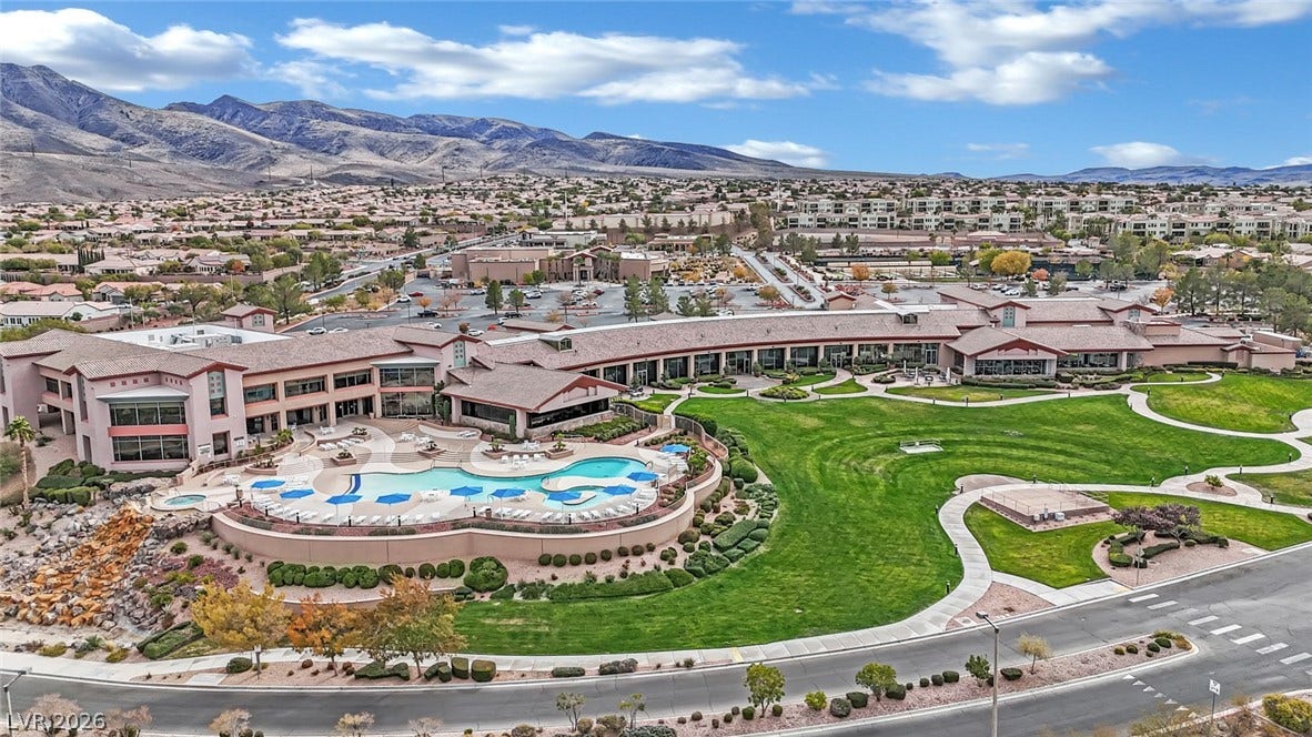 This resort-style property boasts expansive grounds and a sparkling pool, perfect for leisure.
