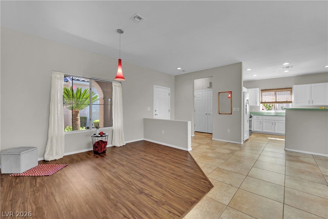 This inviting space offers an open layout, ideal for modern living and seamless transitions.