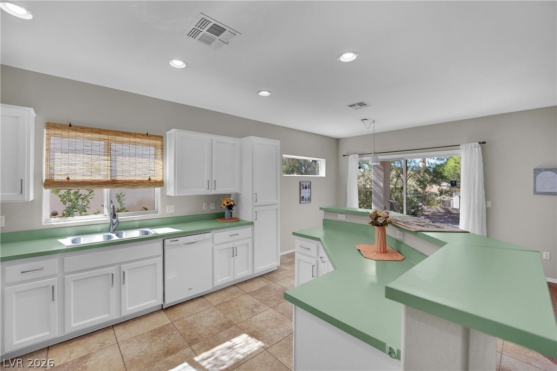 Bright and airy kitchen featuring ample counter space and modern appliances.