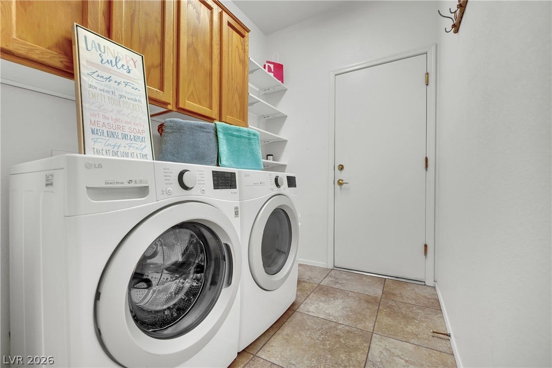 This dedicated space offers functional cabinetry and modern appliances for effortless living.
