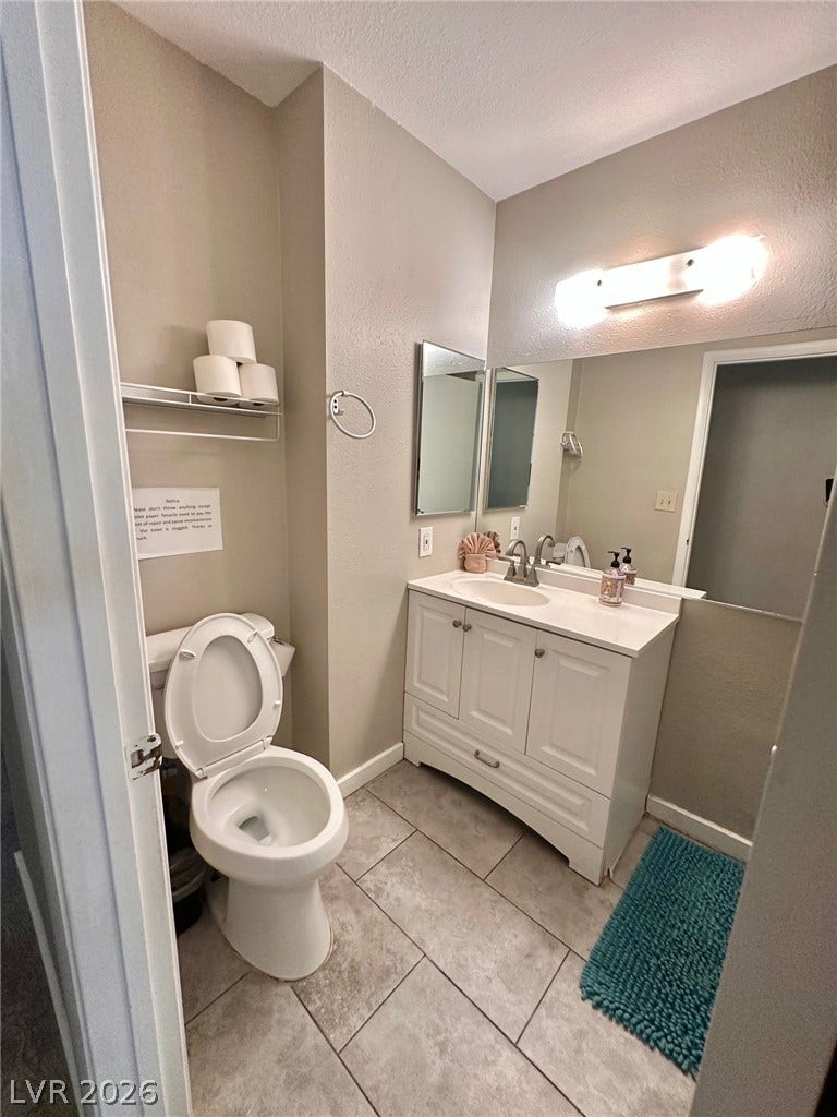 2340 Viewcrest Road, Henderson, NV 89014 This functional bathroom offers a bright vanity and tiled flooring for everyday comfort.