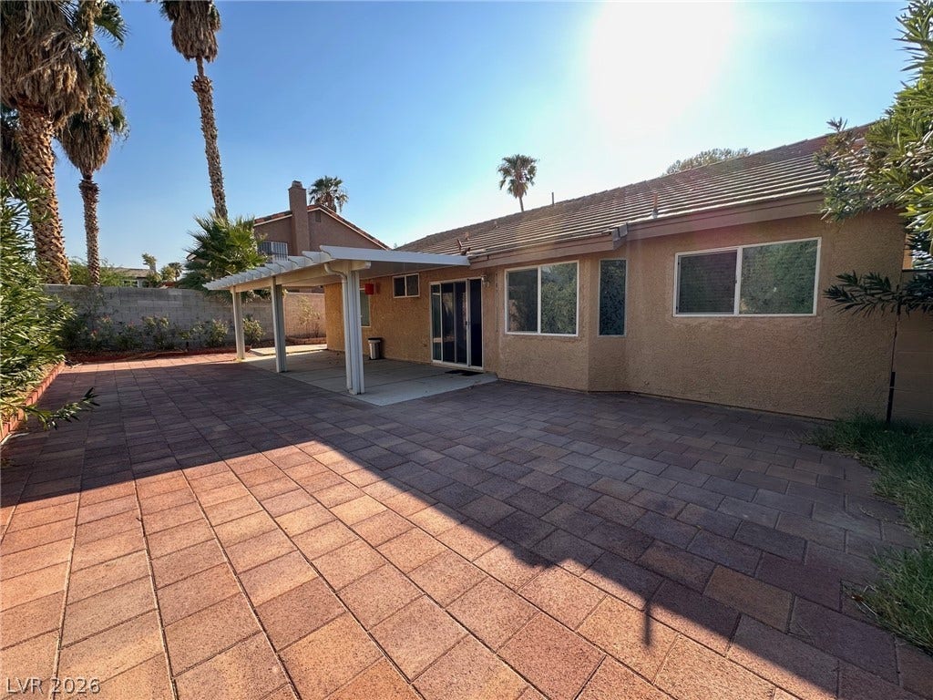 2340 Viewcrest Road, Henderson, NV 89014 This private backyard oasis features an expansive paved patio perfect for outdoor enjoyment.