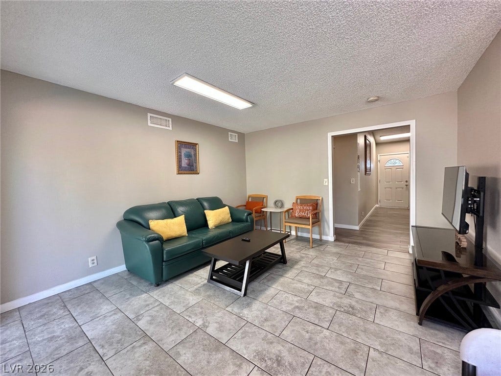 2340 Viewcrest Road, Henderson, NV 89014 This inviting living space features durable tile flooring, offering both style and practicality.