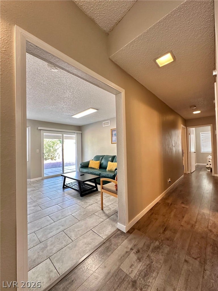 2340 Viewcrest Road, Henderson, NV 89014 This inviting interior features a harmonious blend of flooring, offering comfort and style.