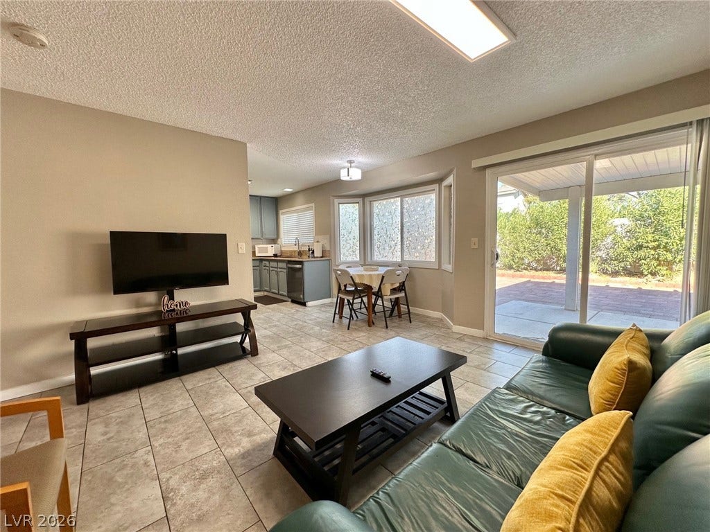 2340 Viewcrest Road, Henderson, NV 89014 This inviting space features a seamless transition from indoor living to an outdoor patio.