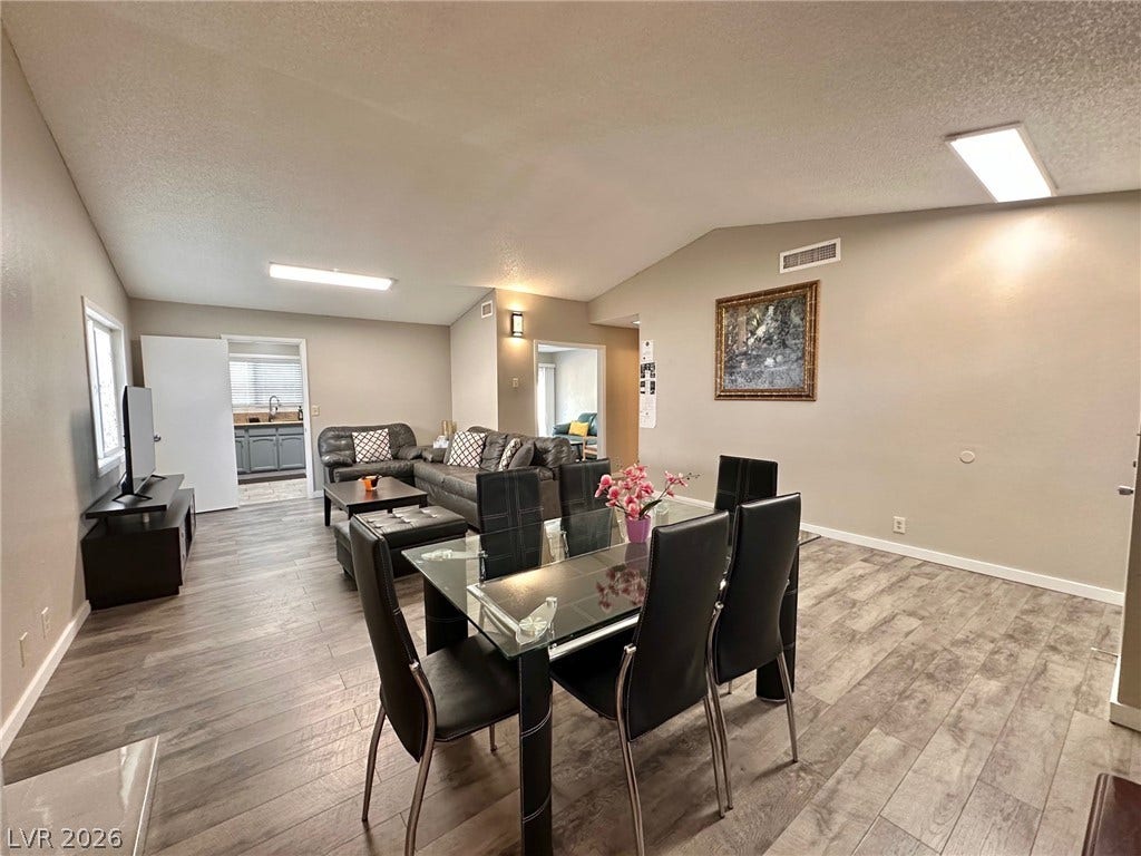 2340 Viewcrest Road, Henderson, NV 89014 This inviting space features durable flooring and an open flow for comfortable living and entertaining.