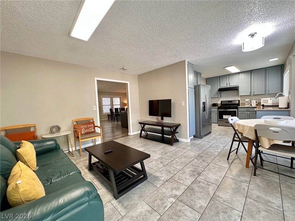 2340 Viewcrest Road, Henderson, NV 89014 This living space seamlessly connects to a functional kitchen, ideal for daily living and entertaining.