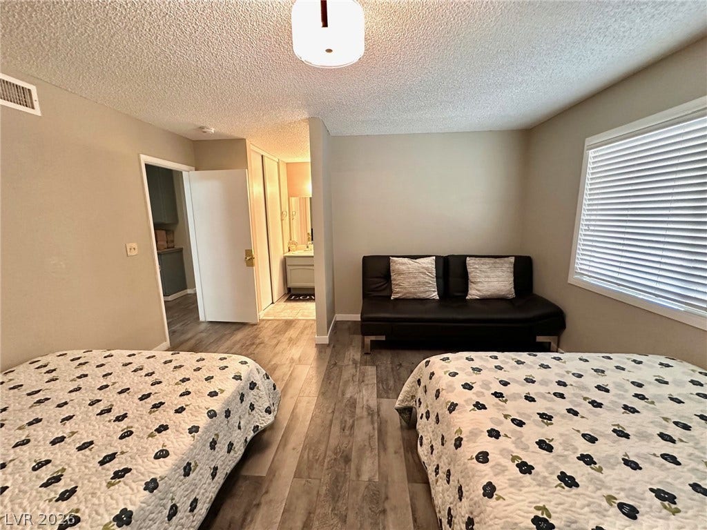 2340 Viewcrest Road, Henderson, NV 89014 This versatile space features durable flooring and a window with blinds, offering adaptable living arrangements.