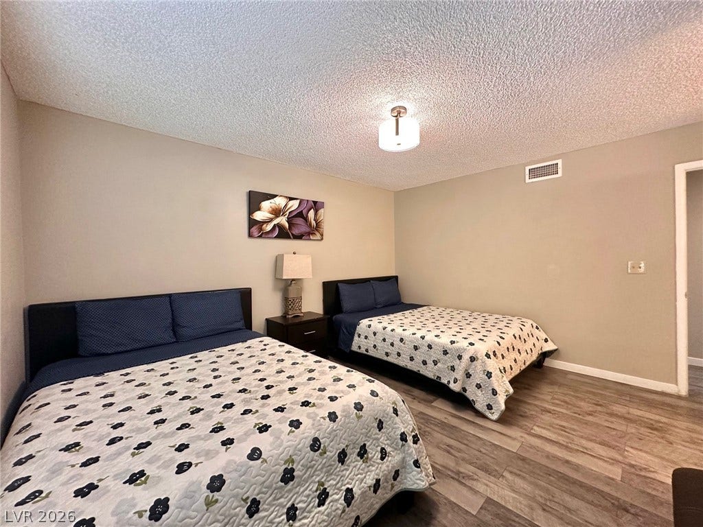 2340 Viewcrest Road, Henderson, NV 89014 This inviting space features durable flooring, offering both comfort and practicality for any lifestyle.