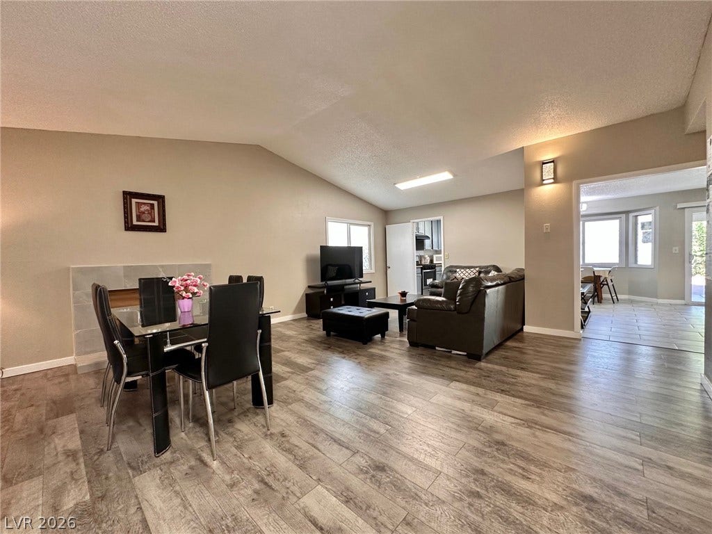 2340 Viewcrest Road, Henderson, NV 89014 This inviting space features an open layout with elegant flooring and abundant natural light.