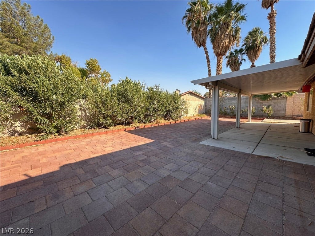 2340 Viewcrest Road, Henderson, NV 89014 This private yard features extensive pavers and a convenient covered patio perfect for outdoor enjoyment.