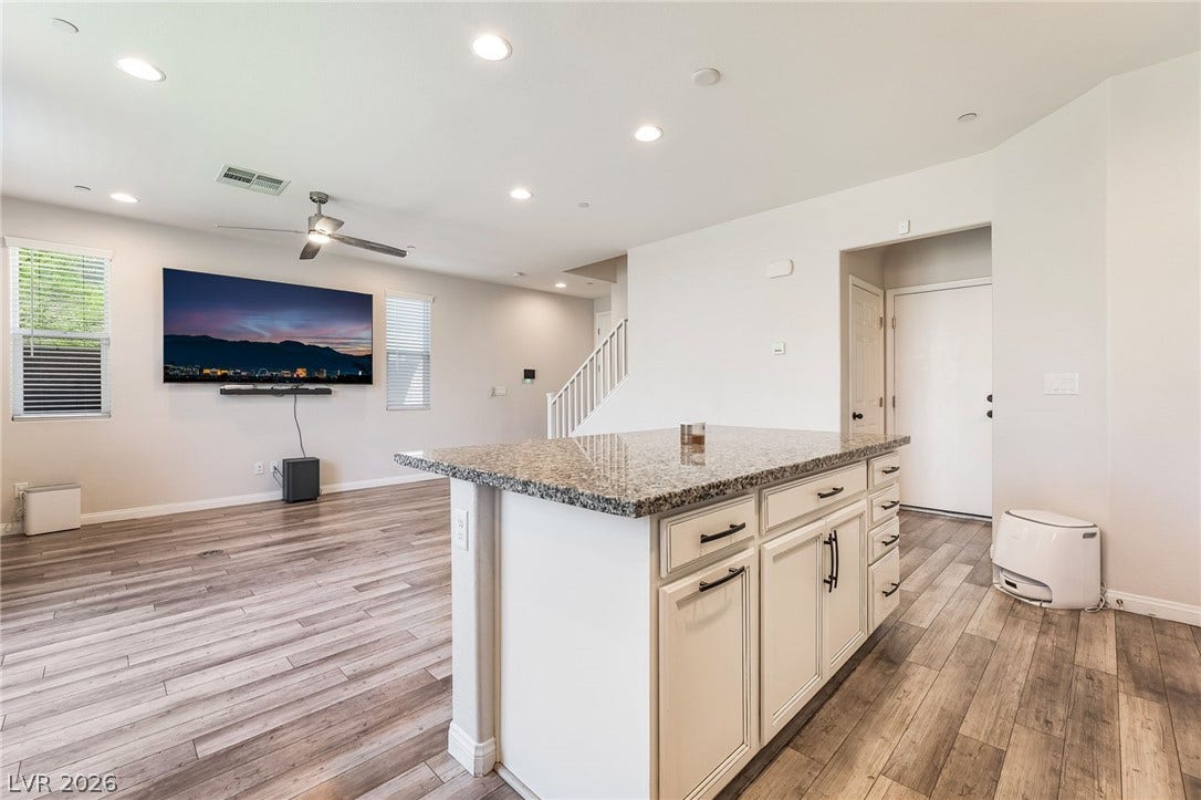 360 Misterioso Street, Henderson, NV 89011 This bright, open-concept living space features durable flooring and a functional kitchen island.