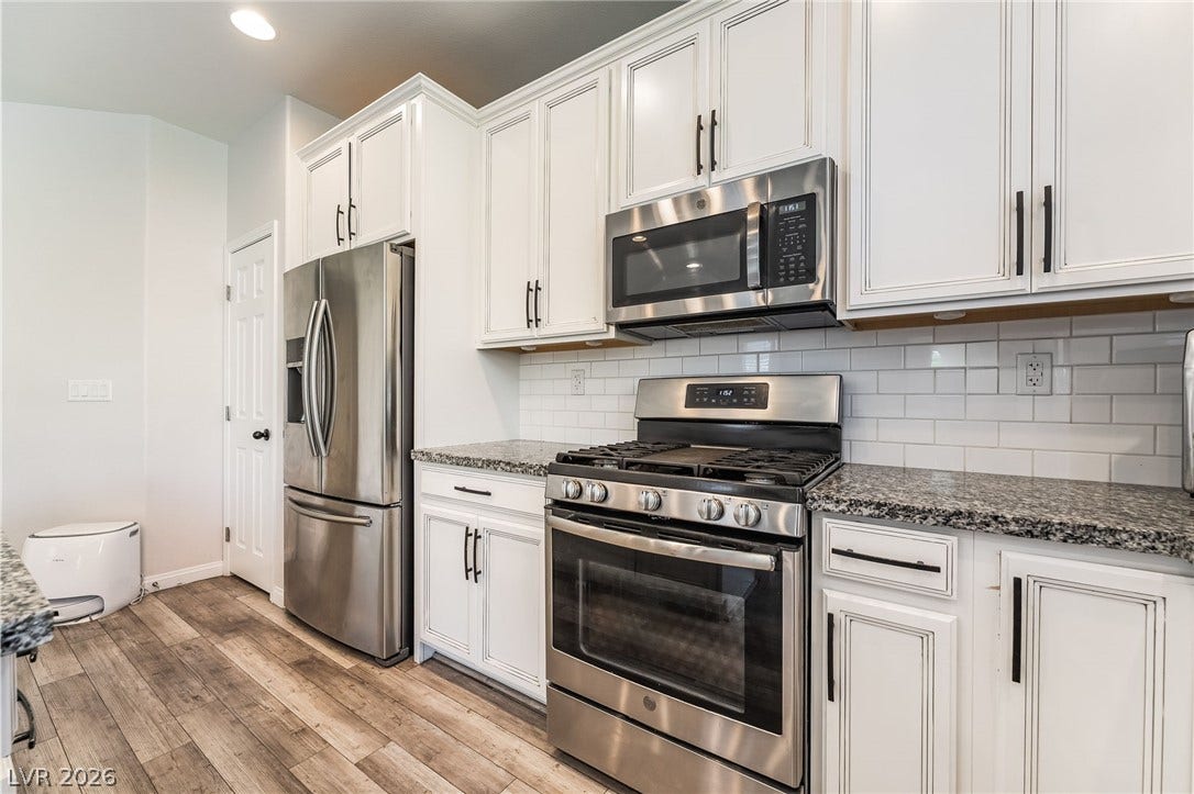 360 Misterioso Street, Henderson, NV 89011 This modern kitchen features stainless steel appliances and ample counter space, perfect for everyday living.