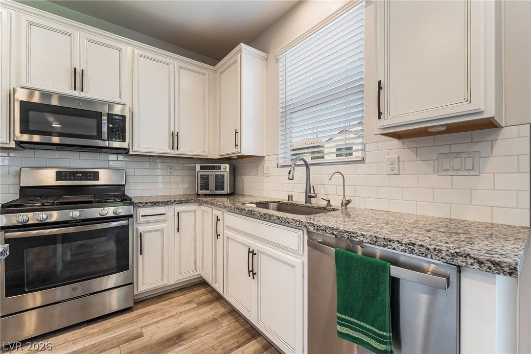 360 Misterioso Street, Henderson, NV 89011 This bright kitchen features sleek appliances and ample counter space, perfect for culinary endeavors.
