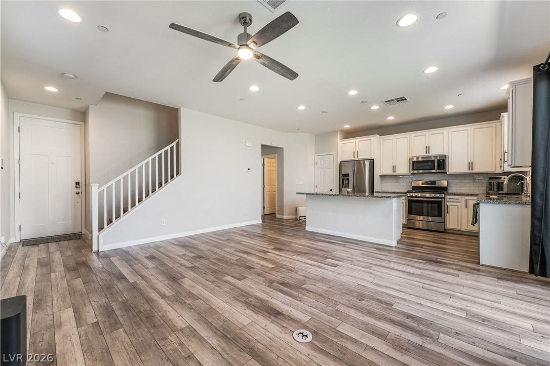 360 Misterioso Street, Henderson, NV 89011 This bright and open space seamlessly connects the kitchen and living areas for modern living.