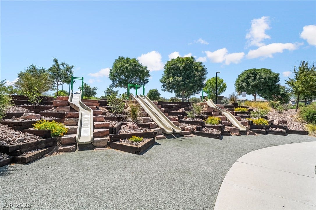 360 Misterioso Street, Henderson, NV 89011 This playful park area offers multiple slides integrated into a landscaped hill.