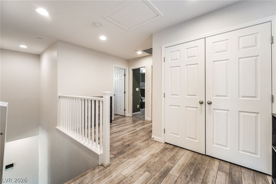360 Misterioso Street, Henderson, NV 89011 This bright hallway connects spaces with elegant flooring and architectural details.