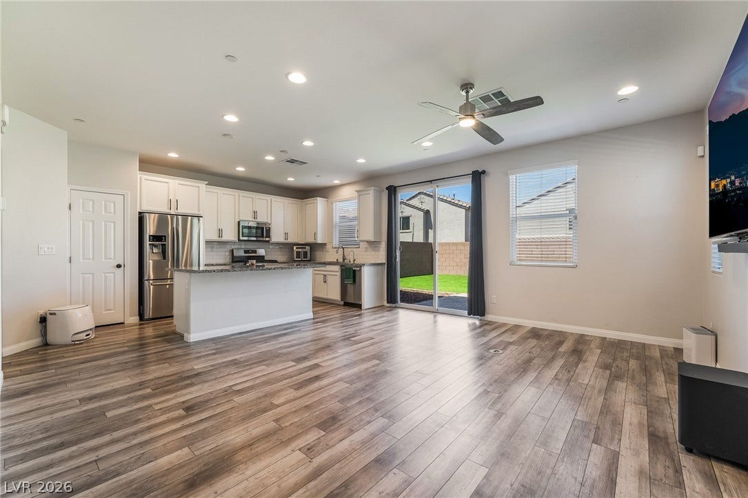 360 Misterioso Street, Henderson, NV 89011 This bright open-concept living space features modern finishes and a seamless transition to outdoor living.
