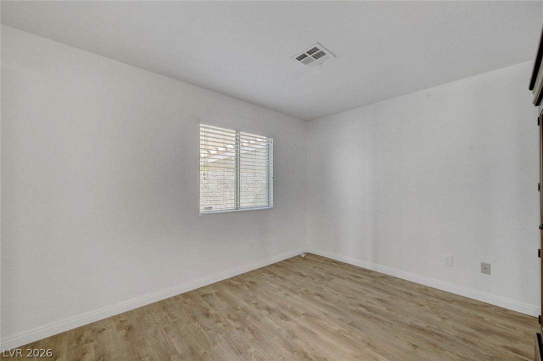 31 Antero Drive, Henderson, NV 89074 A well-lit room with wood flooring, offering a versatile space for various uses.