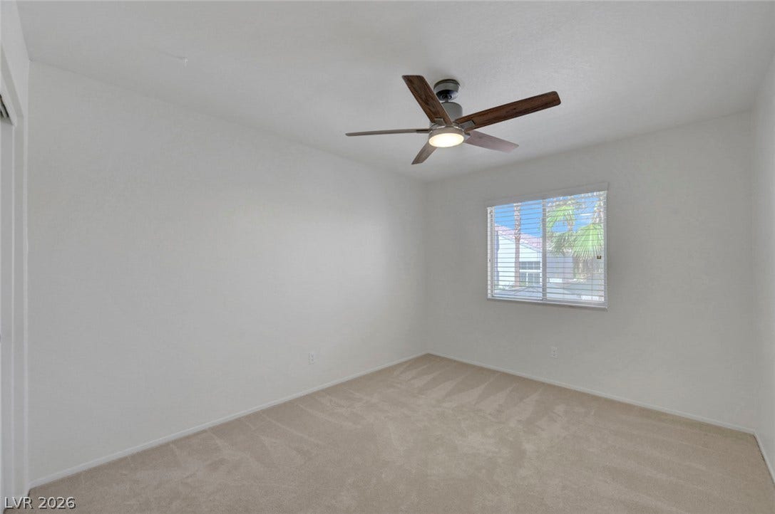 31 Antero Drive, Henderson, NV 89074 A versatile bedroom offering comfort and a cooling ceiling fan for optimal airflow.
