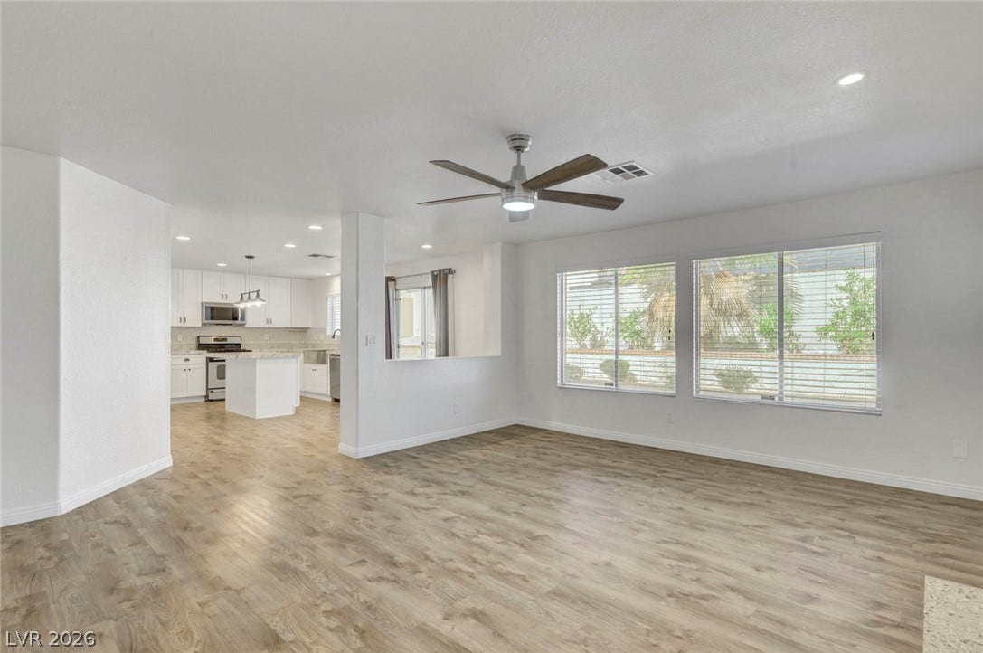31 Antero Drive, Henderson, NV 89074 An open concept living area boasts a modern kitchen and abundant natural light.
