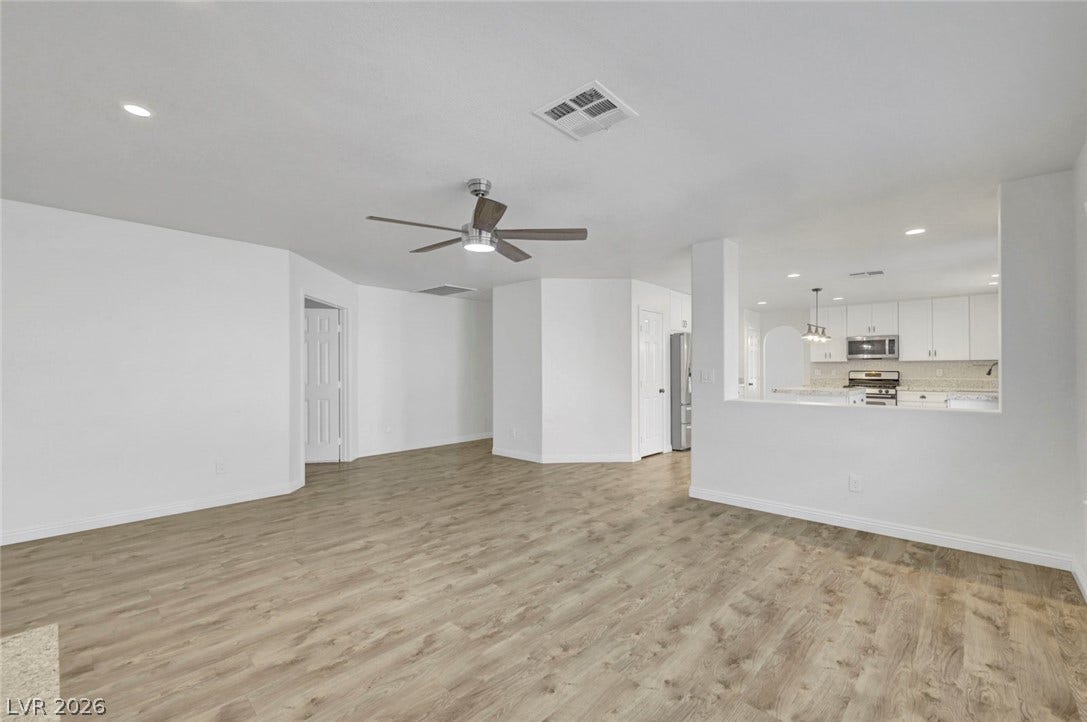 31 Antero Drive, Henderson, NV 89074 Laminate flooring connects an airy living space with a contemporary kitchen.