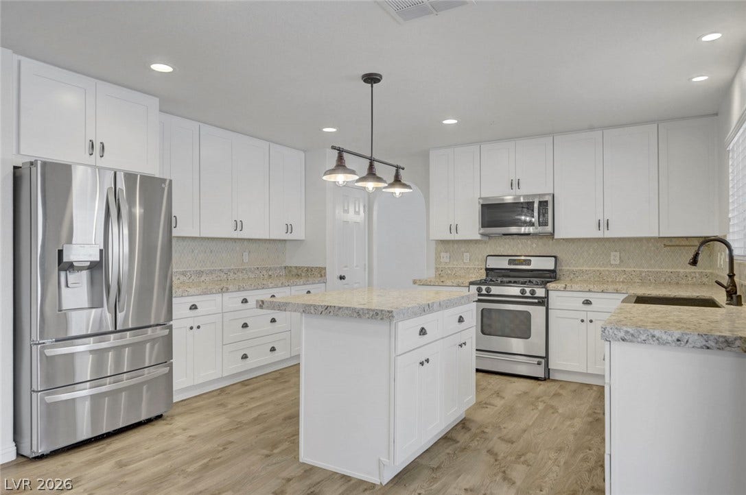 31 Antero Drive, Henderson, NV 89074 Culinary delights await in this bright kitchen with a spacious island and gleaming appliances.