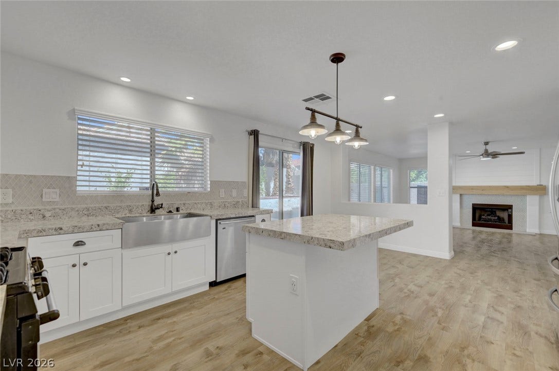 31 Antero Drive, Henderson, NV 89074 A seamless open floorplan unites the kitchen, complete with a functional island, with the adjacent living space.