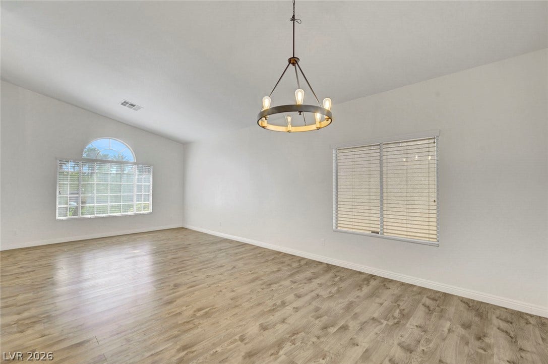 31 Antero Drive, Henderson, NV 89074 A living space offers generous proportions and light wood flooring for effortless styling.