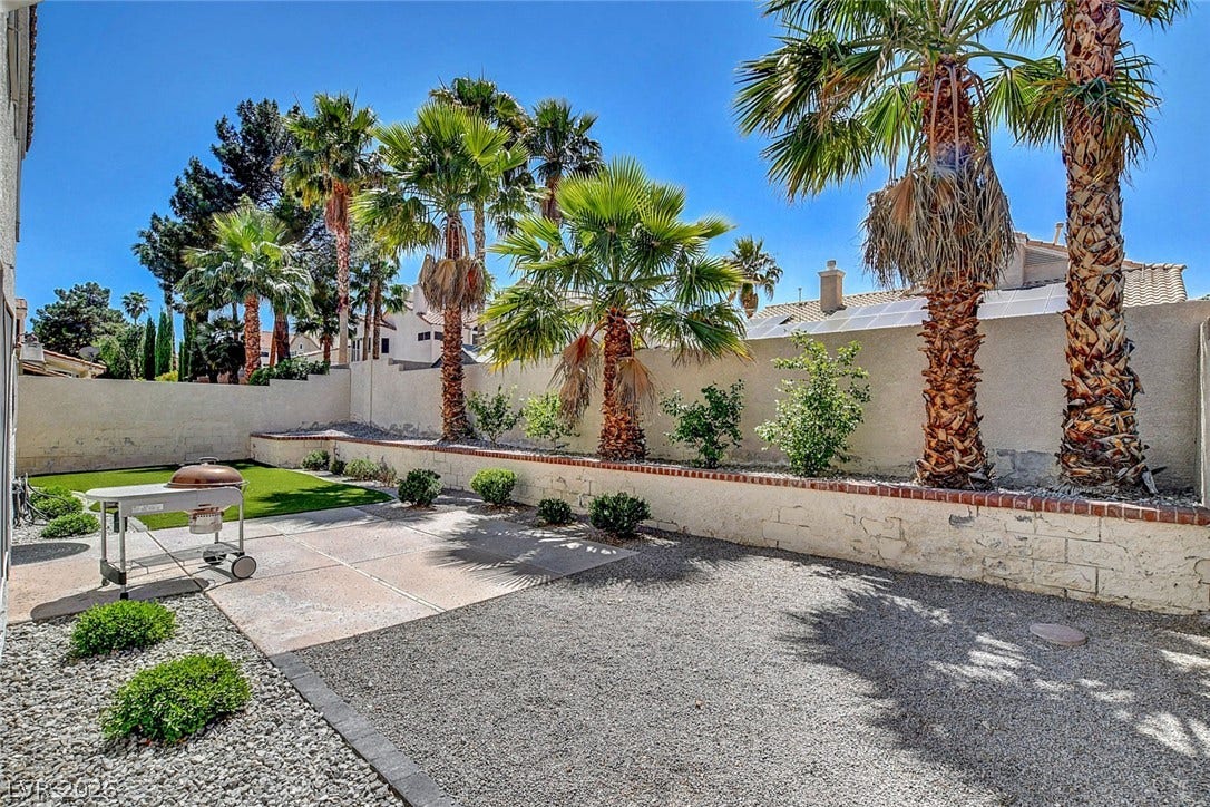 31 Antero Drive, Henderson, NV 89074 A well-maintained outdoor space offers a private retreat with diverse landscaping and a spacious patio.