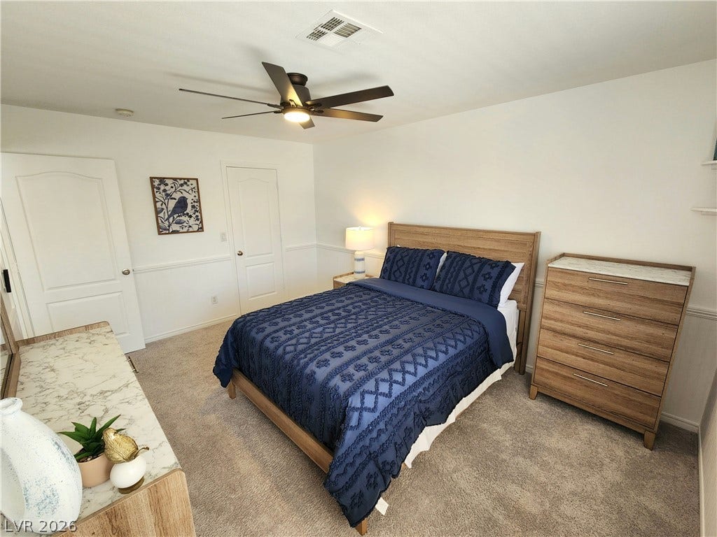 2743 Peekskill Avenue, Henderson, NV 89052 Bright bedroom with warm natural light and textured carpeting, ideal for serene relaxation.