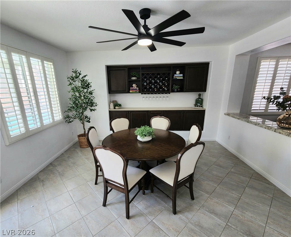 2743 Peekskill Avenue, Henderson, NV 89052 This bright dining area features an integrated wine rack and a view of the outdoors.