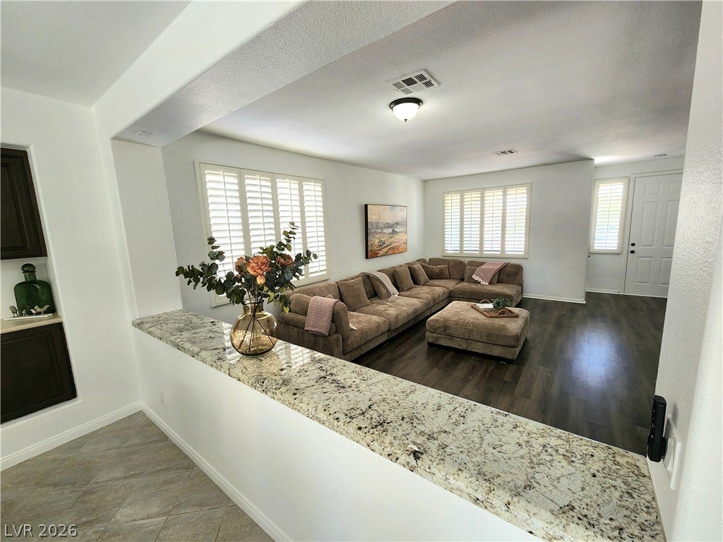 2743 Peekskill Avenue, Henderson, NV 89052 This inviting space features a charming pass-through window with granite counters.