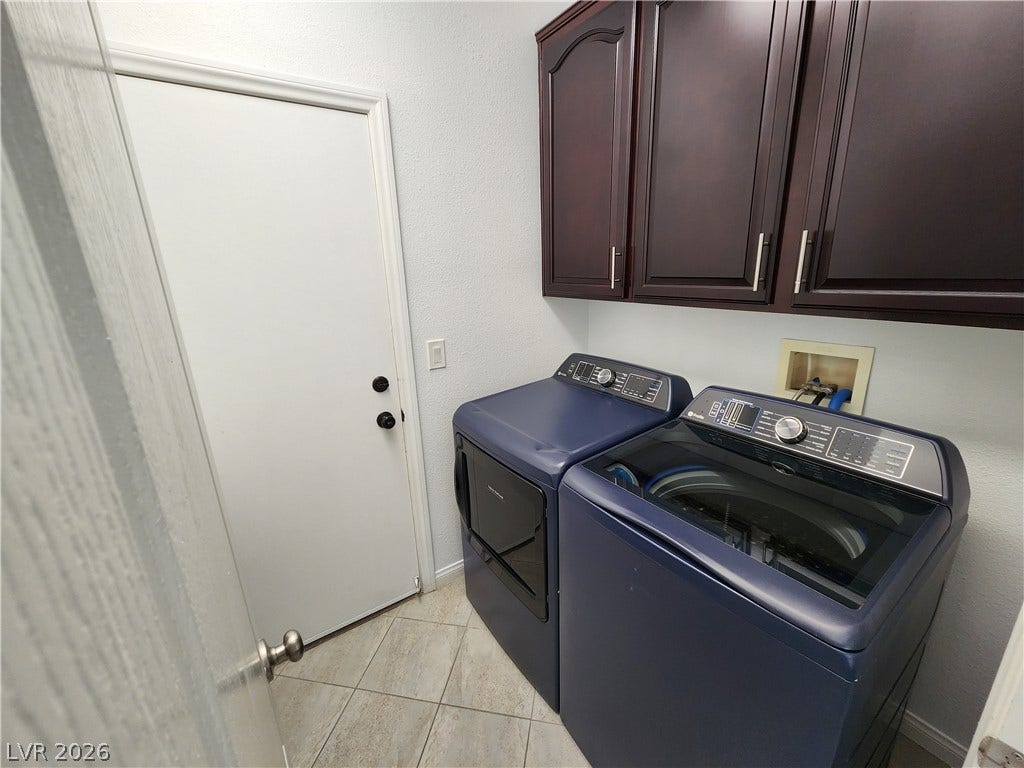 2743 Peekskill Avenue, Henderson, NV 89052 This functional laundry area features ample storage and modern appliances for everyday convenience.