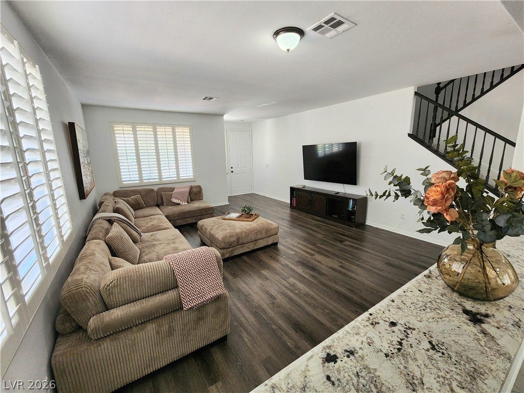 2743 Peekskill Avenue, Henderson, NV 89052 This inviting living space features elegant flooring and abundant natural light.