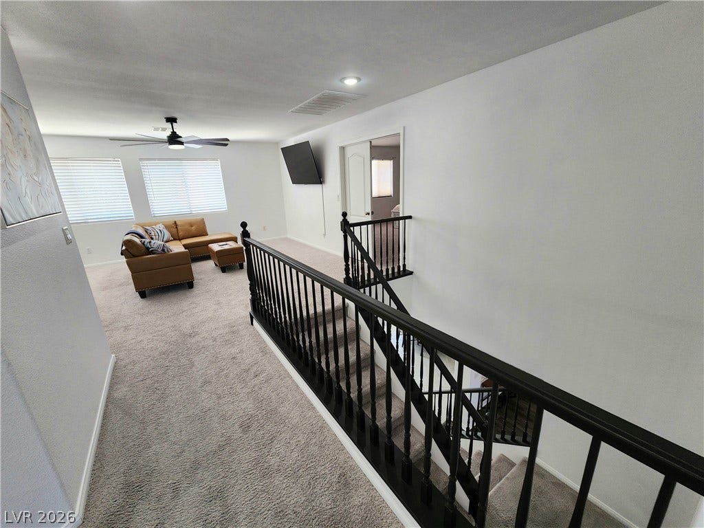 2743 Peekskill Avenue, Henderson, NV 89052 This inviting space features a comfortable sitting area, creating a welcoming atmosphere for relaxation and leisure.