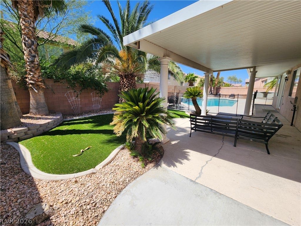 2743 Peekskill Avenue, Henderson, NV 89052 This private outdoor retreat features a covered patio, refreshing pool, and manicured landscaping.